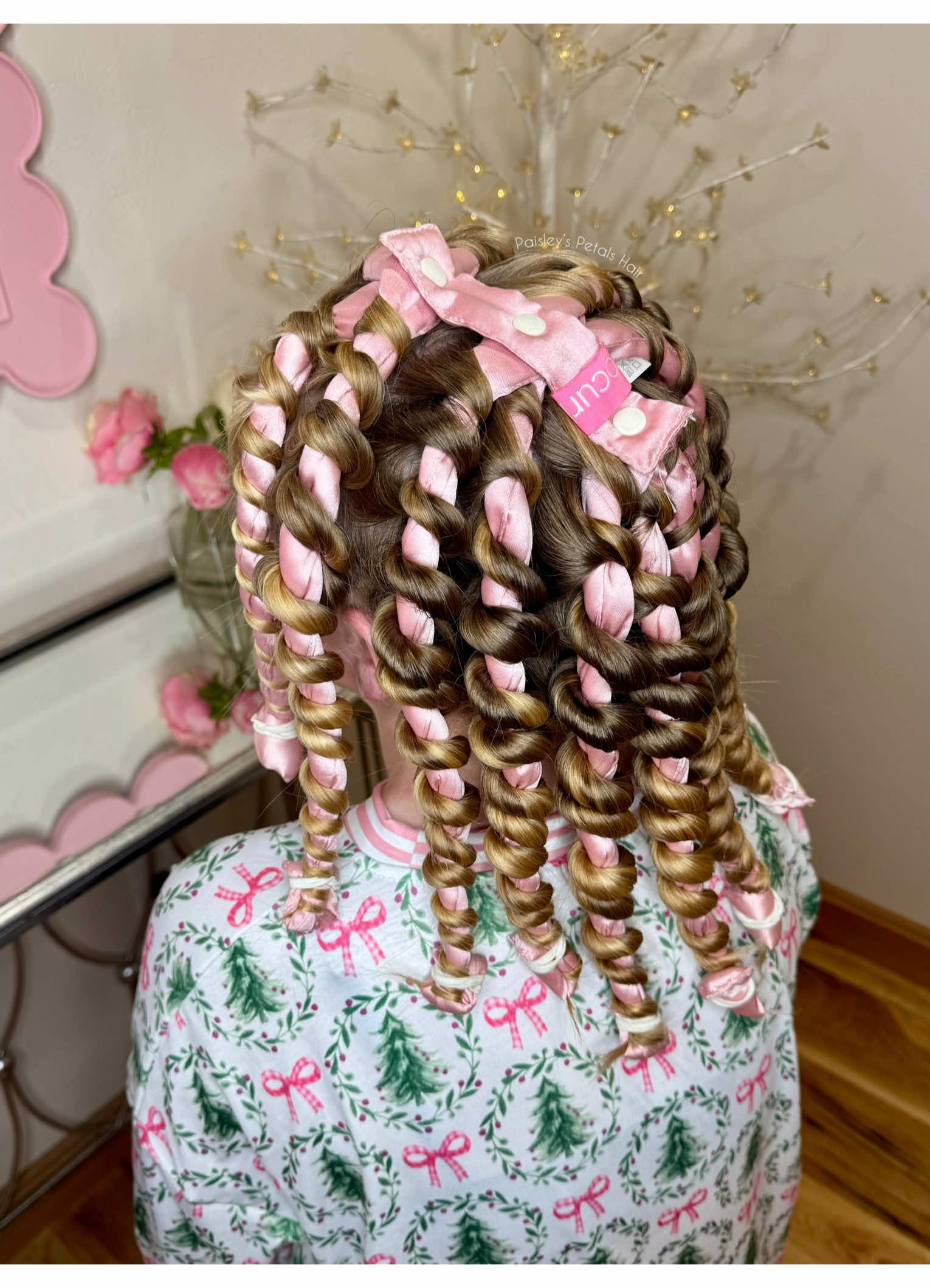 TikTok post by @paisleyspetalshair for Paul Mitchell. Caption reads: How to achieve gorgeous heatless curls! 1. Start....