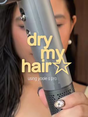 TikTok post by @kmaemories for Yoole. Caption reads: upgraded my hair dryer with this @YOOLE life S pro....