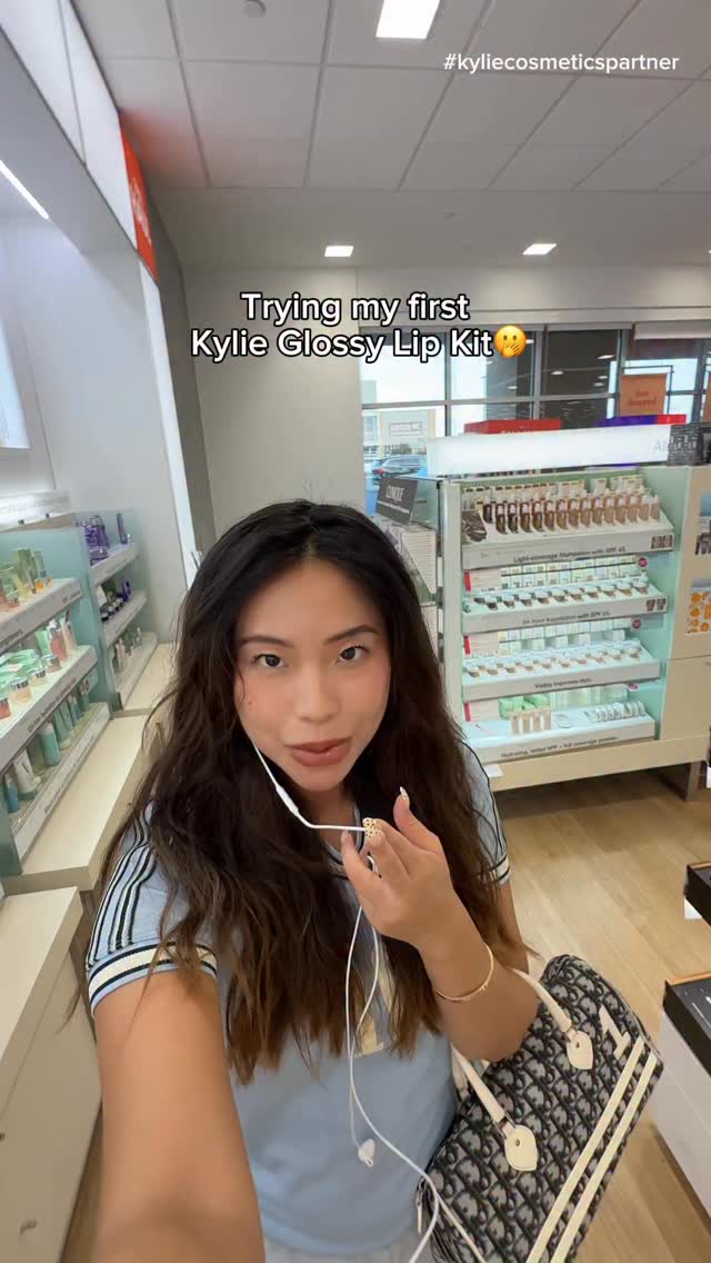 Instagram post by @christxiee for Kylie Cosmetics. Caption reads: You guys told me to try the glossy kits from....