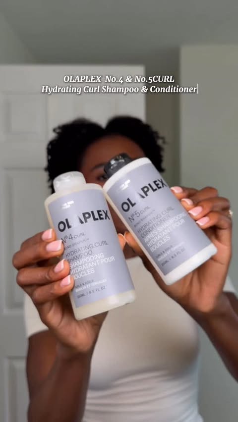 Instagram post by @ginab.xo for OLAPLEX. Caption reads: With the NEW @olaplex No.4 & No.5CURL Hydrating....