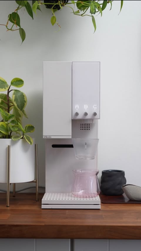 Instagram post by @daddygotcoffee for xBloom. Caption reads: A year later and the @xbloom_coffee Studio still....