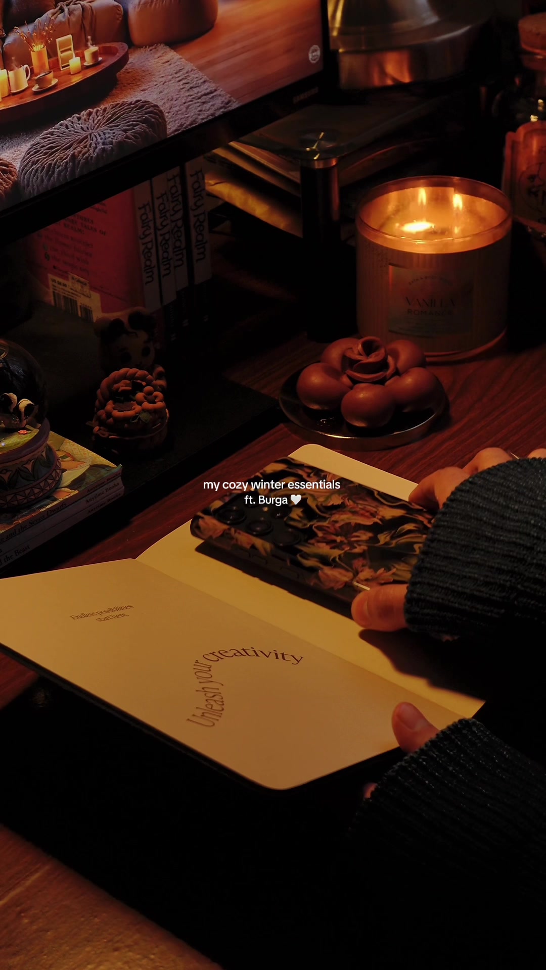 TikTok post by @lettersandlanterns for BURGA. Caption reads: my cozy winter essentials ft @BURGA, here’s my....