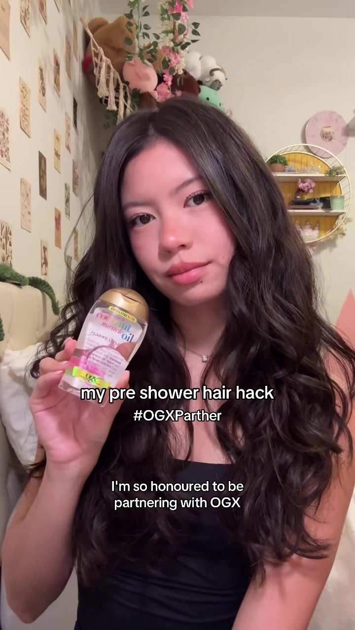 TikTok post by @itsoizzie for OGX Beauty. Caption reads: #OGXPartner My hack to keep my hair looking....