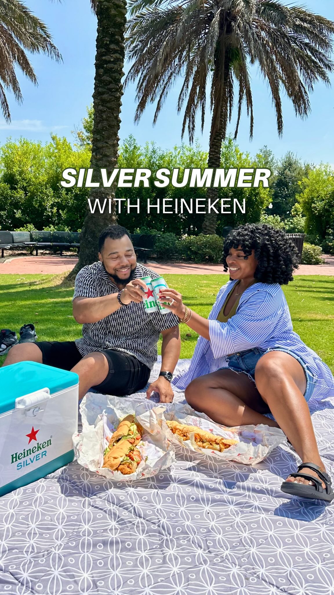 Instagram post by @tamlovestoeat for Heineken US. Caption reads: AD 21+| Shrimp po’ boys, a shady spot at the park....
