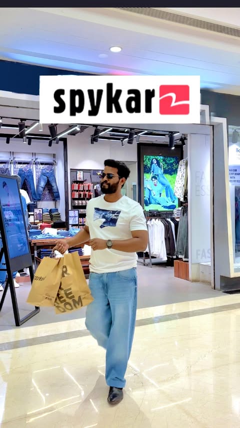 Instagram post by @atharva_tandel for SPYKAR. Caption reads: @spykarofficial = Aura++ ✨ . Walking into Spykar....