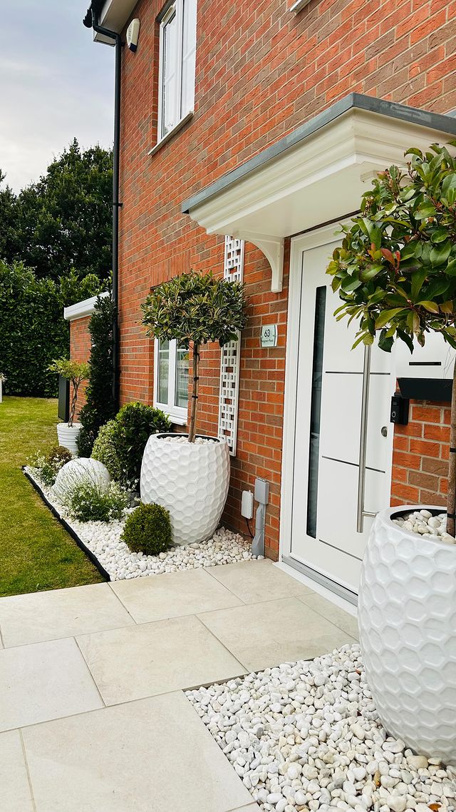 Instagram post by @carlyshomeandlifestyle_ for The Palladio Door Collection. Caption reads: Transforming our front this summer!! 
.
It Started....