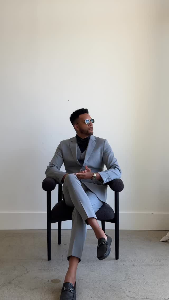 Instagram post by @yes_im_black for Azazie. Caption reads: Pop out of the blue in an @azaziebridal suit.....