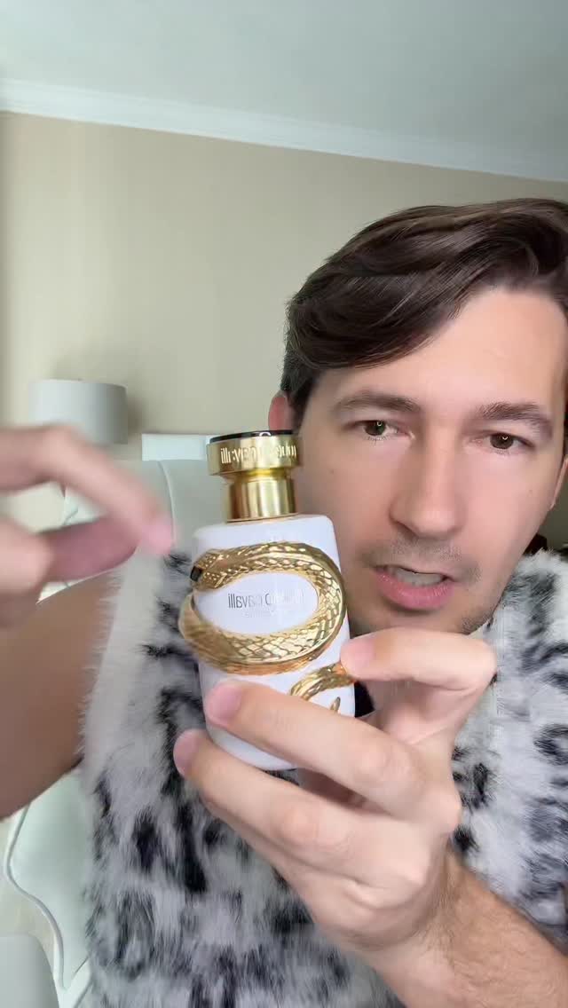 Instagram post by @ideservecouture for Roberto Cavalli. Caption reads: Fragrance and a bracelet in one? Brilliant!!! It’s....