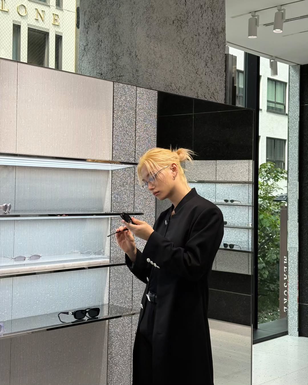 Instagram post by @yong.lixx for GENTLE MONSTER. Caption reads: @gentlemonster
🖤🖤🖤
#ad #felix #straykids #stay....