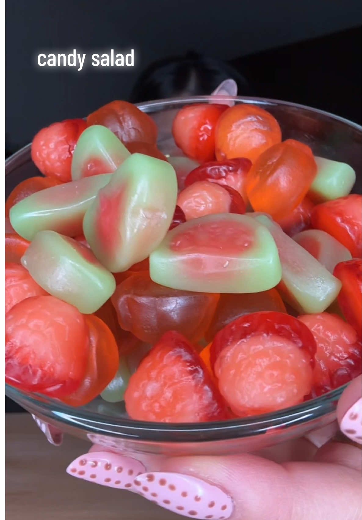 TikTok post by @sarah.slurps for Amos Sweets. Caption reads: [...] 🍬 Valentines candy salad 💘 @AMOS Sweets MX....