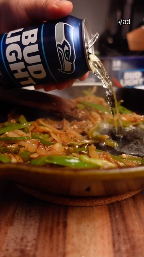 Instagram post by @theemoodyfoody for Bud Light. Caption reads: Even when making a game day feast - it’s easy to....