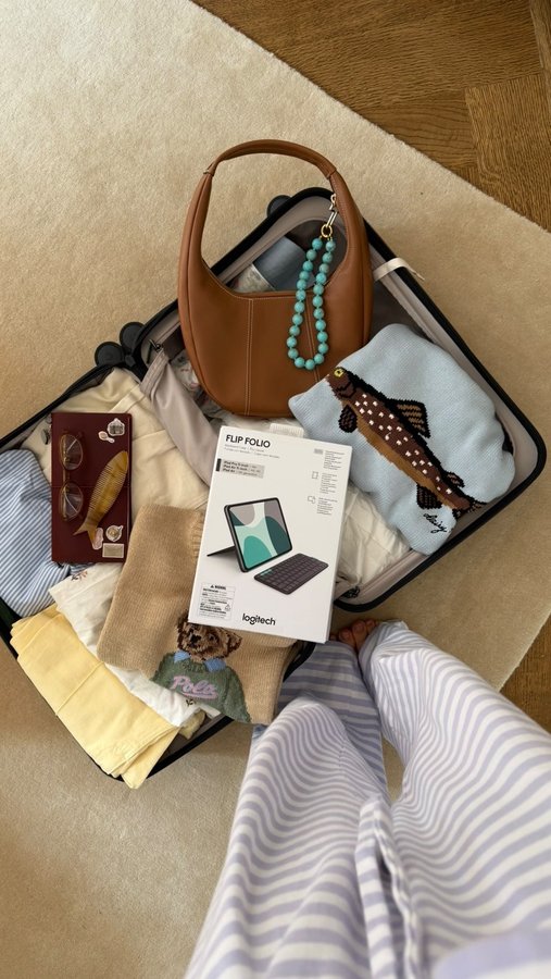 Instagram post by @thatgirlsophy for Logitech. Caption reads: Cozy fall, tiny tables, big ideas - my iPad’s new....