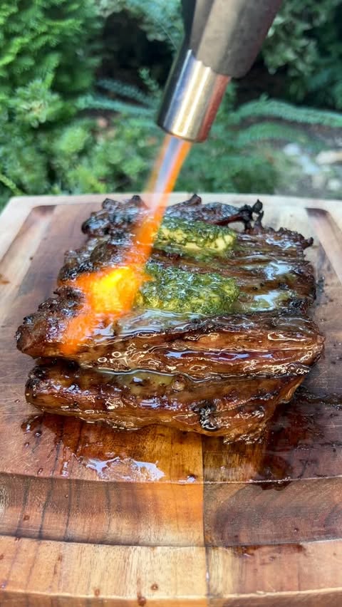 Instagram post by @bacusbbq for Kamado Joe. Caption reads: [...] flavor grilling over wood on my @kamadojoe....