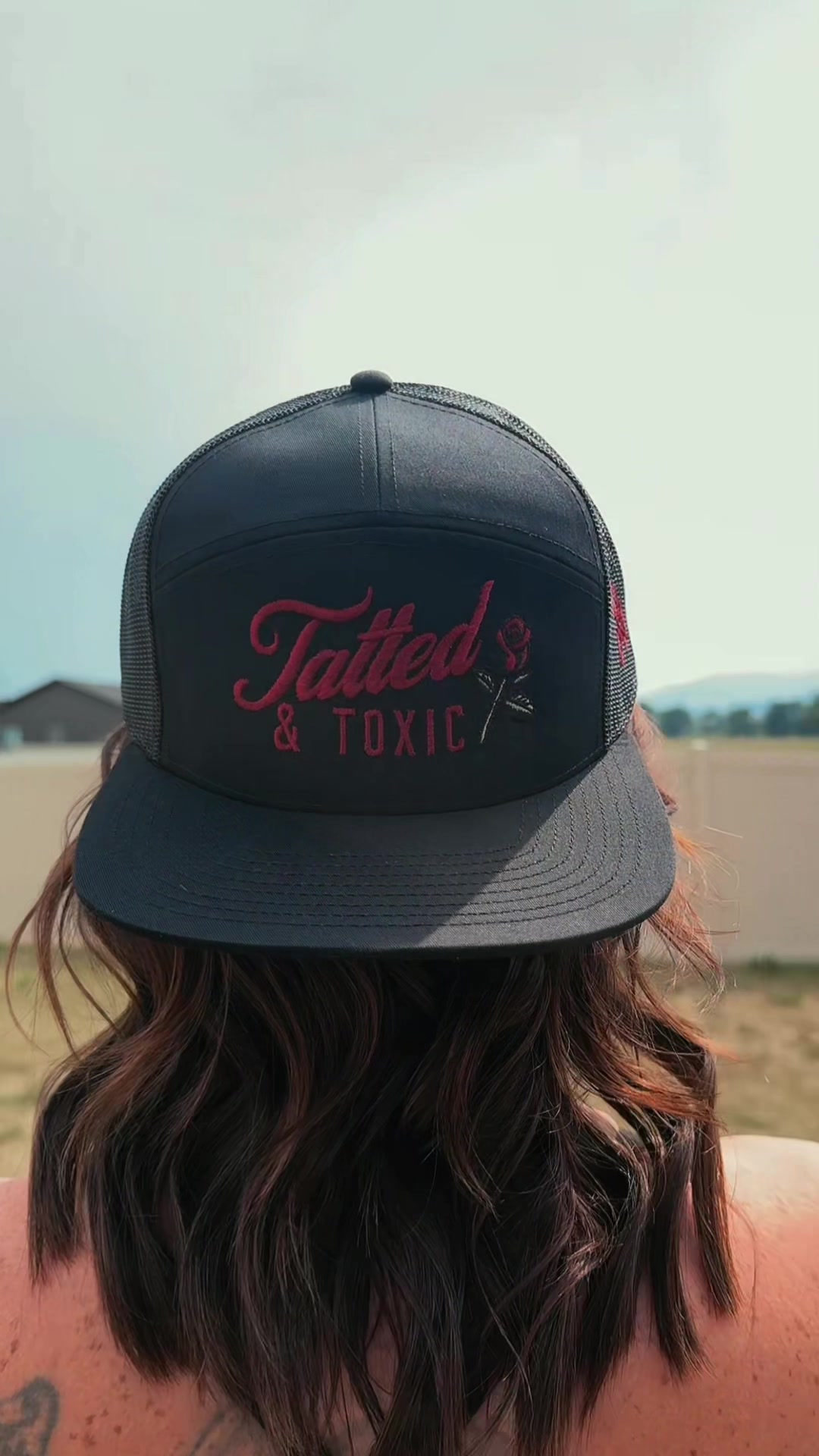 TikTok post by @brittdawn for The Mad Hatter Company. Caption reads: [...] & Toxic Trucker SnapBack Hat @The Mad Hatter....