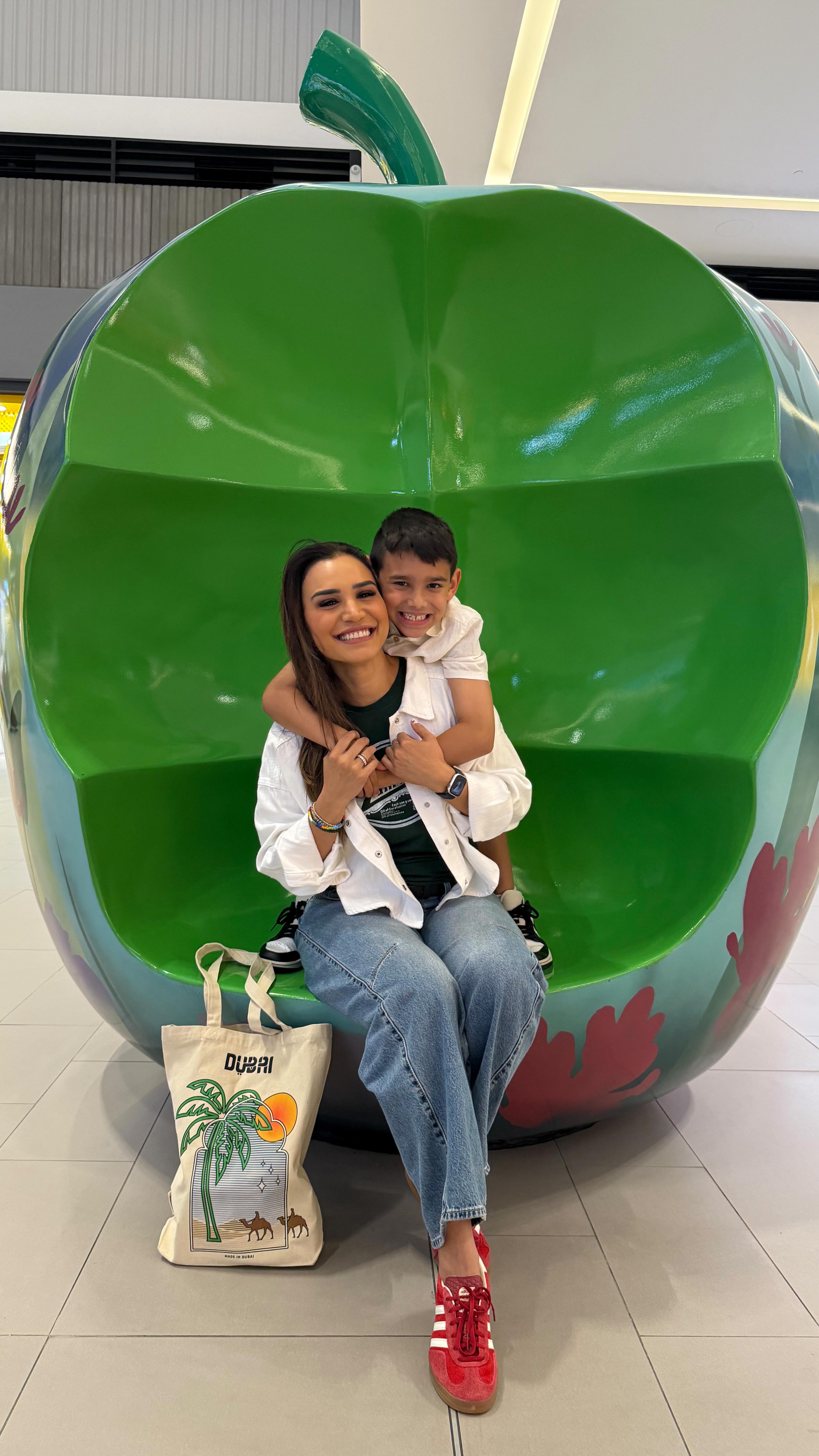 Instagram post by @mrszahmarty for Visit Dubai. Caption reads: Shop, play, dine, @dubaihillsmall has it all!....