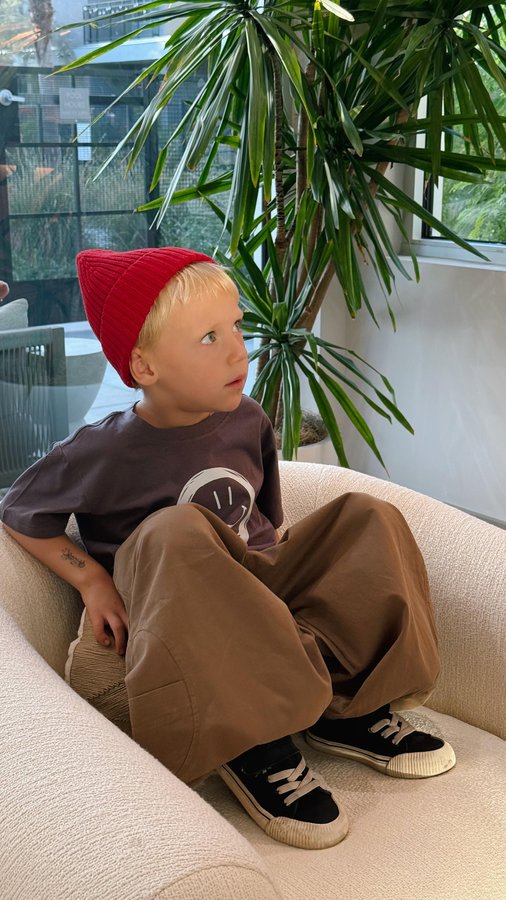 Instagram post by @ne.chaiieva for MiniOlie. Caption reads: whoever said dressing a boy wasn’t fun just didn’t....