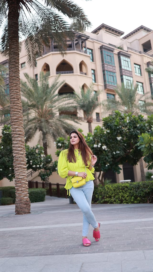 Instagram post by @thedoubleyoublog for Burj Khalifa by Emaar. Caption reads: OOTD in motion ✨ Shopped my today’s look from....
