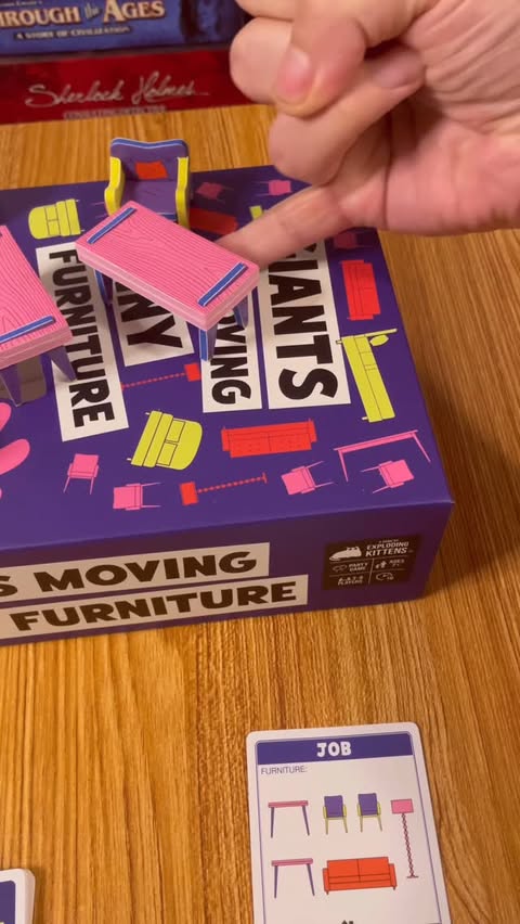 Instagram post by @tiktokboardgames for Exploding Kittens. Caption reads: The stakes are BIG, the chairs are little 🪑....