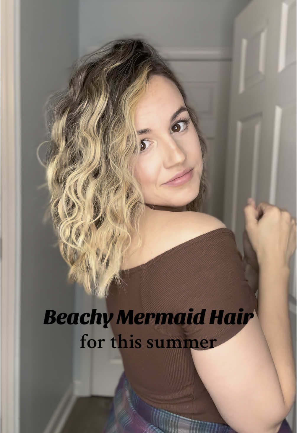 TikTok post by @hairwithamy for TYMO Beauty. Caption reads: [...] #wavyhair #tymobeauty #curlstymo [...].