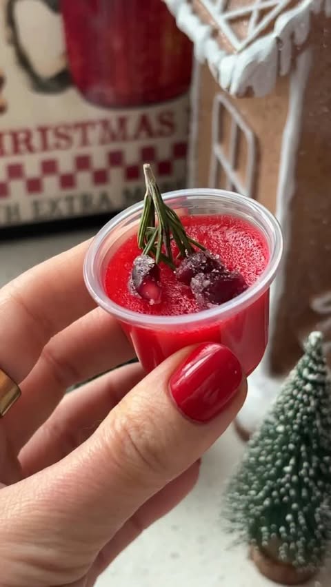 Instagram post by @basicswithbails for 1UP Nutrition. Caption reads: Sour Cherry Protein Jello Shots 🍒

Protein? In a....