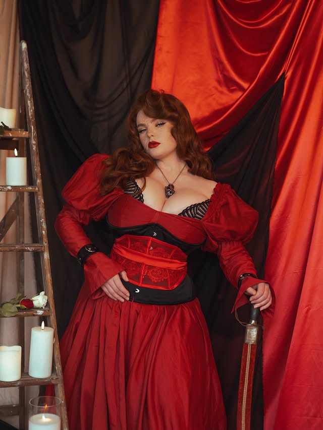 Instagram post by @missdeadlyred for What Katie Did. Caption reads: [...] cincher- @playfulpromises 🥀 Corset-....