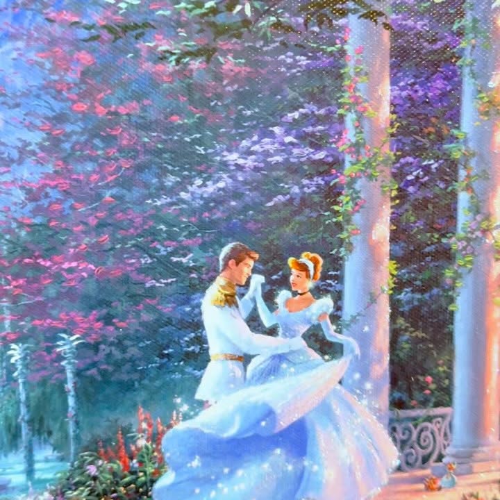 Instagram post by @disneylifestylers for Thomas Kinkade Studios. Caption reads: Bring the enchanting magic of Cinderella Castle....