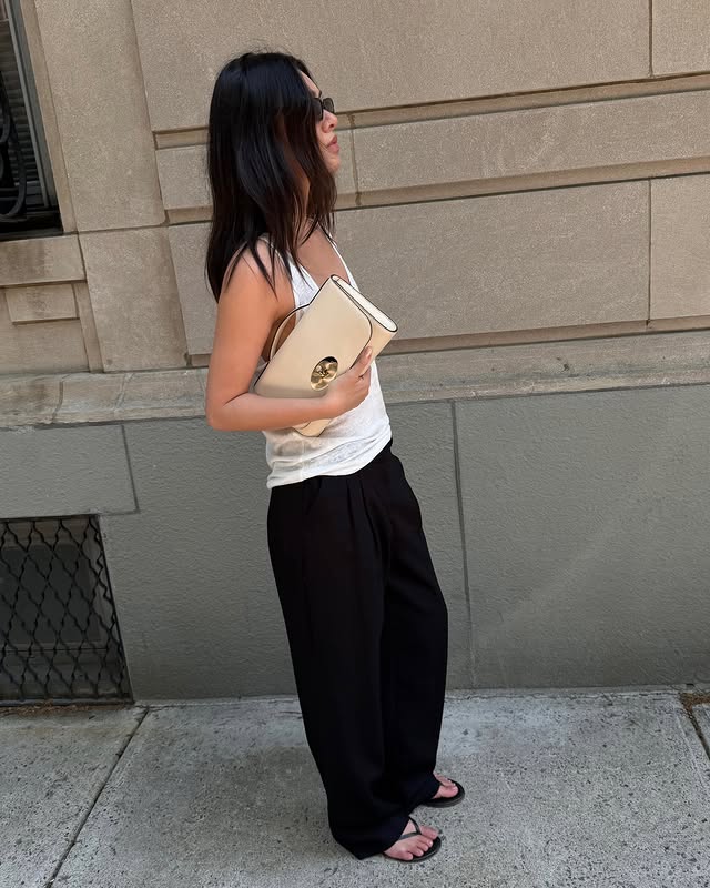 Instagram post by @mimixn for Mulberry. Caption reads: Taking my @mulberryengland clutch day to night #ad.