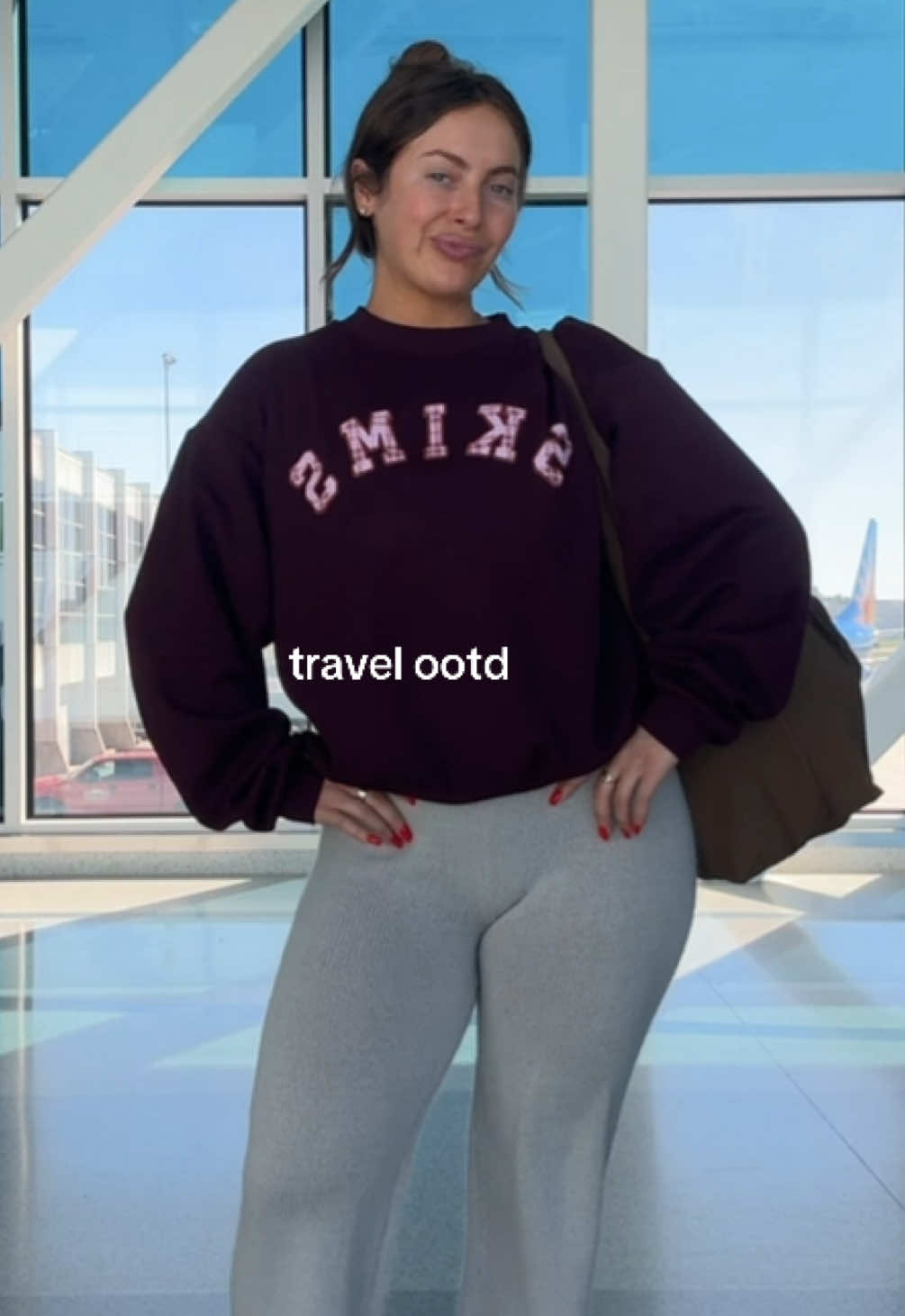 TikTok post by @christinadesid for Skims. Caption reads: [...] and got a size large in the crewneck! @SKIMS....