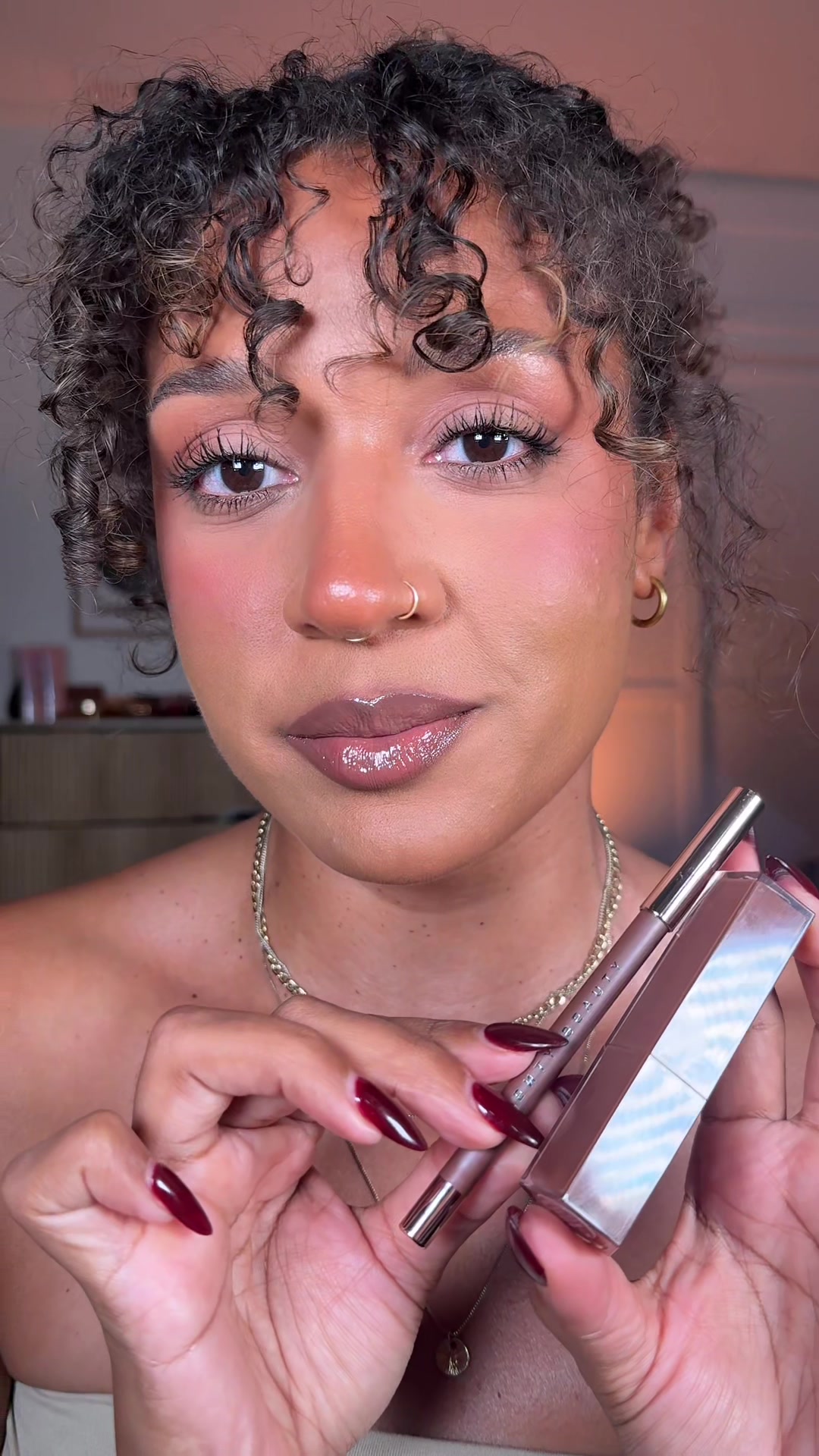 TikTok post by @leigha_chrstine for Fenty Beauty. Caption reads: [...] cool-toned brown lip combo from Fenty....