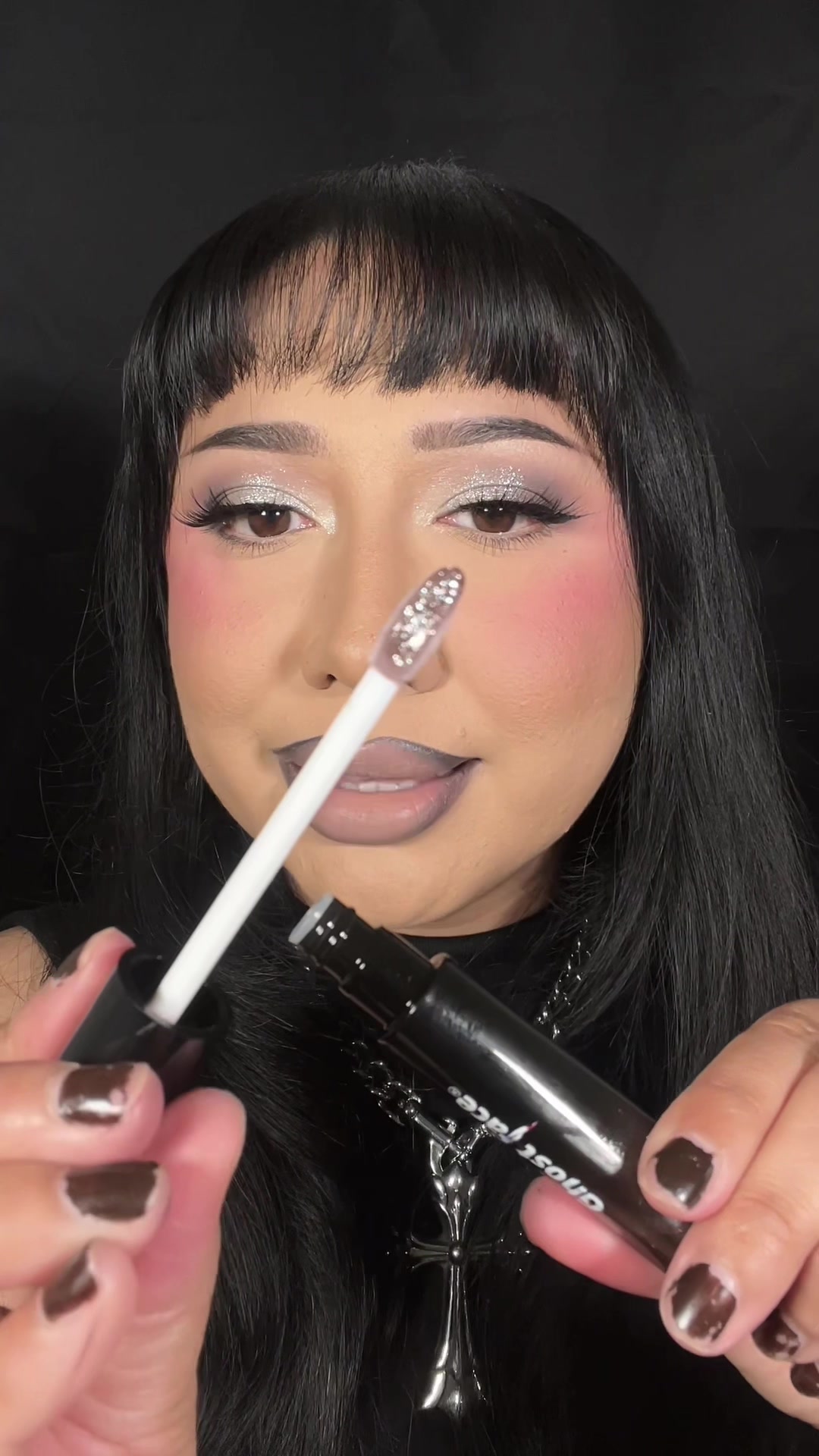 TikTok post by @eveysolorio for Glamlite. Caption reads: Obsessed with this cool toned glittery lip combo!....