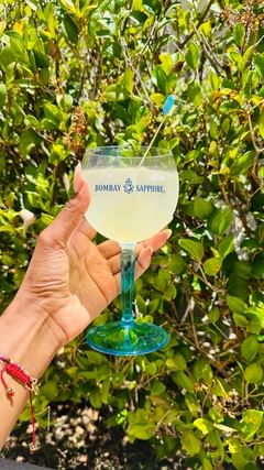 Instagram post by @justaddhotsauce for BOMBAY SAPPHIRE. Caption reads: it’s a gin party all summer with @bombaysapphireus....