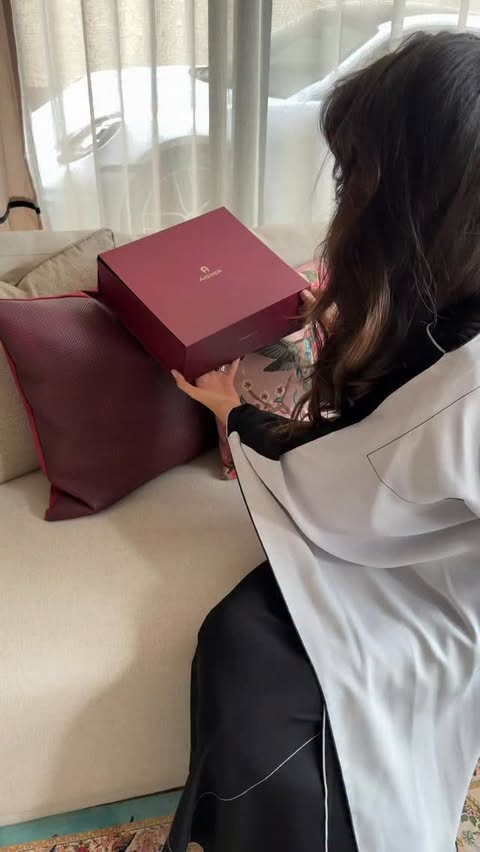 Instagram post by @joudalnamla for Etienne Aigner AG. Caption reads: From Iftar to Suhoor with AIGNER ✨ Effortless....