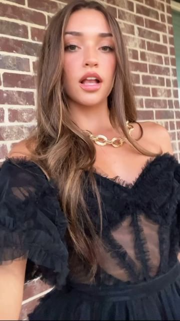 Instagram post by @itspresleyelise for Sherri Hill. Caption reads: my heartbeat🖤 @sherrihill.