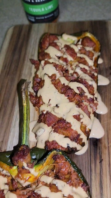 Instagram post by @girldadbbq for Spaceman Knives. Caption reads: Tequila Lime Brisket Stuffed Poblanos with....