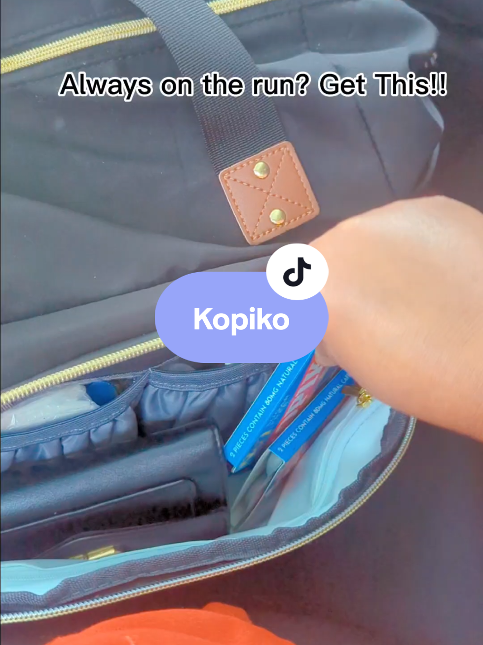 TikTok post by @mama_poudel for Kopiko USA. Caption reads: A new addition to my diaper bag essentials and....