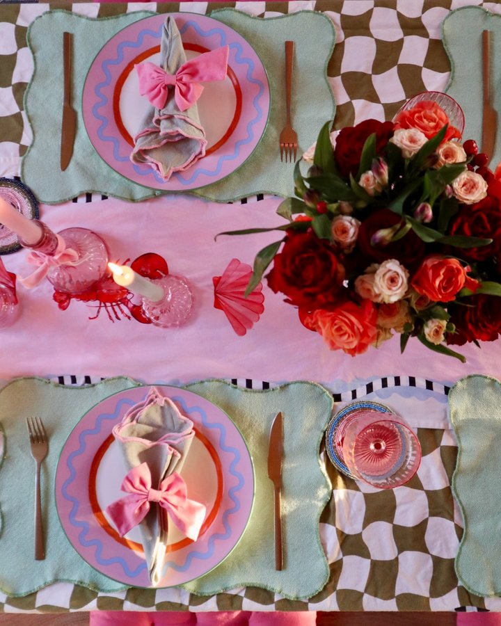 Instagram post by @megmonde for Yellowpop. Caption reads: A little valentines table setting 🦞❤️🎀🌹 {ad -....