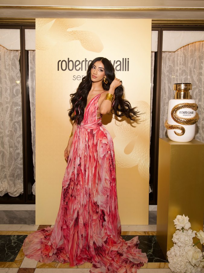 Instagram post by @tamkaur for Roberto Cavalli. Caption reads: Draped in Cavalli, scented by Cavalli. #Serpentine....