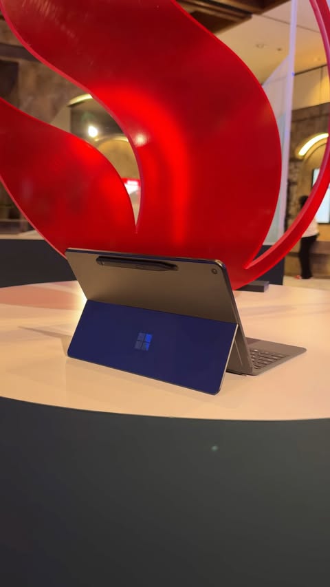 Instagram post by @johnnyhochstetler for Snapdragon. Caption reads: [...] Surface Pro to work during my trip to​....