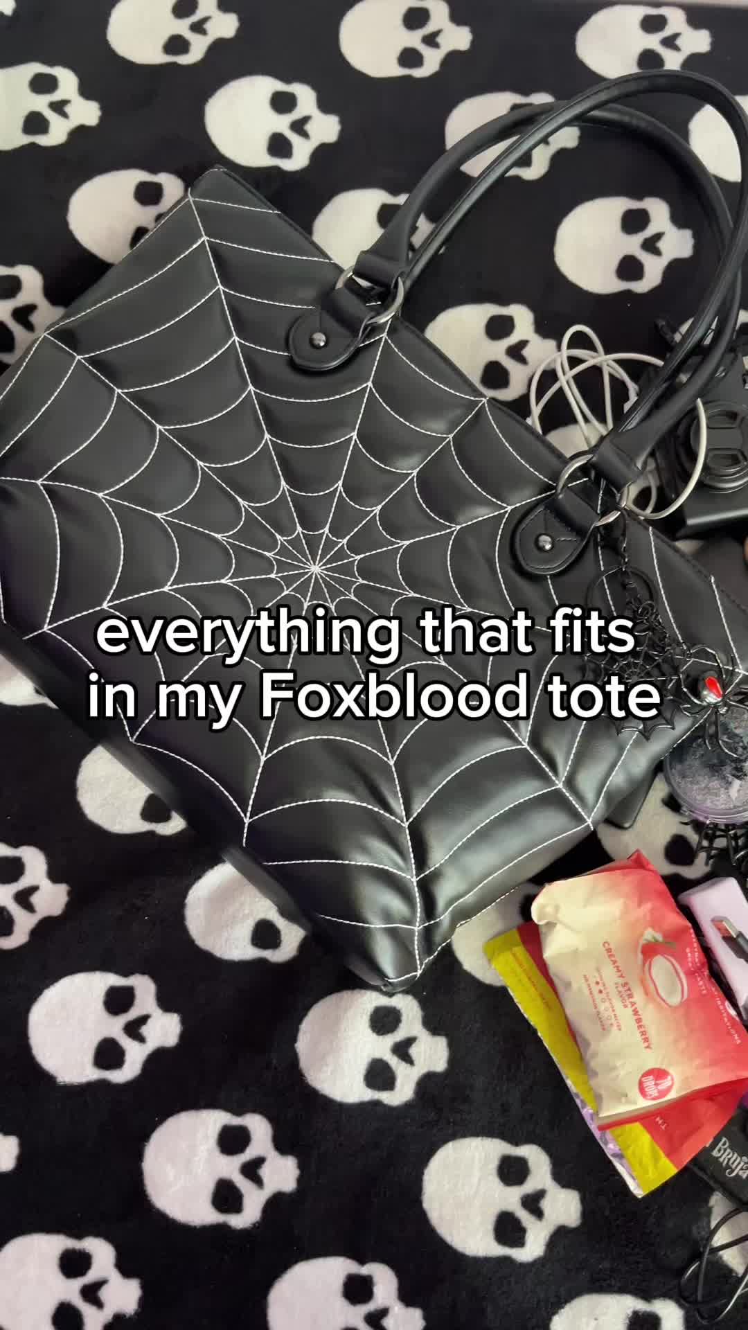 TikTok post by @dahlialuxx for Foxblood. Caption reads: i love my @Foxblood Shop tote 🖤 i've got my eye....