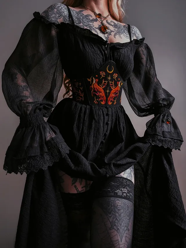 Instagram post by @kllsym for Restyle.pl. Caption reads: [...] corset 🦊🧡 Fireborne collection from....