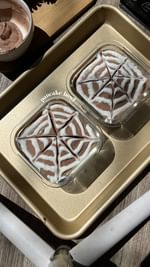 Instagram post by @regs_healthy_eats for Protein World. Caption reads: RECIPE / RECETA⬇️

Spiderweb brownie pancake....