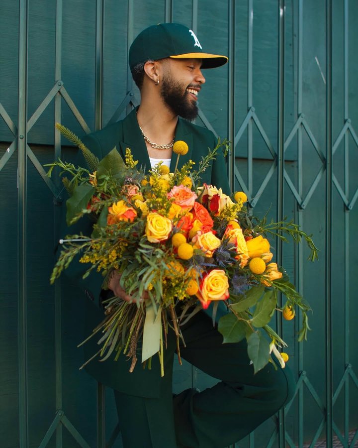 Instagram post by @joshreeves for UrbanStems. Caption reads: [...] Hold on. Life will get warmer. Shop....