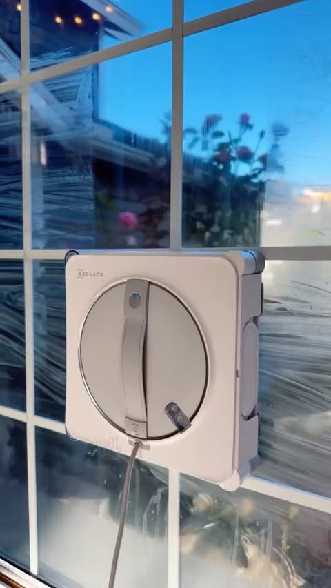 Instagram post by @sierrawardas_ for ECOVACS ROBOTICS. Caption reads: Tired of dirty windows but zero energy to clean....
