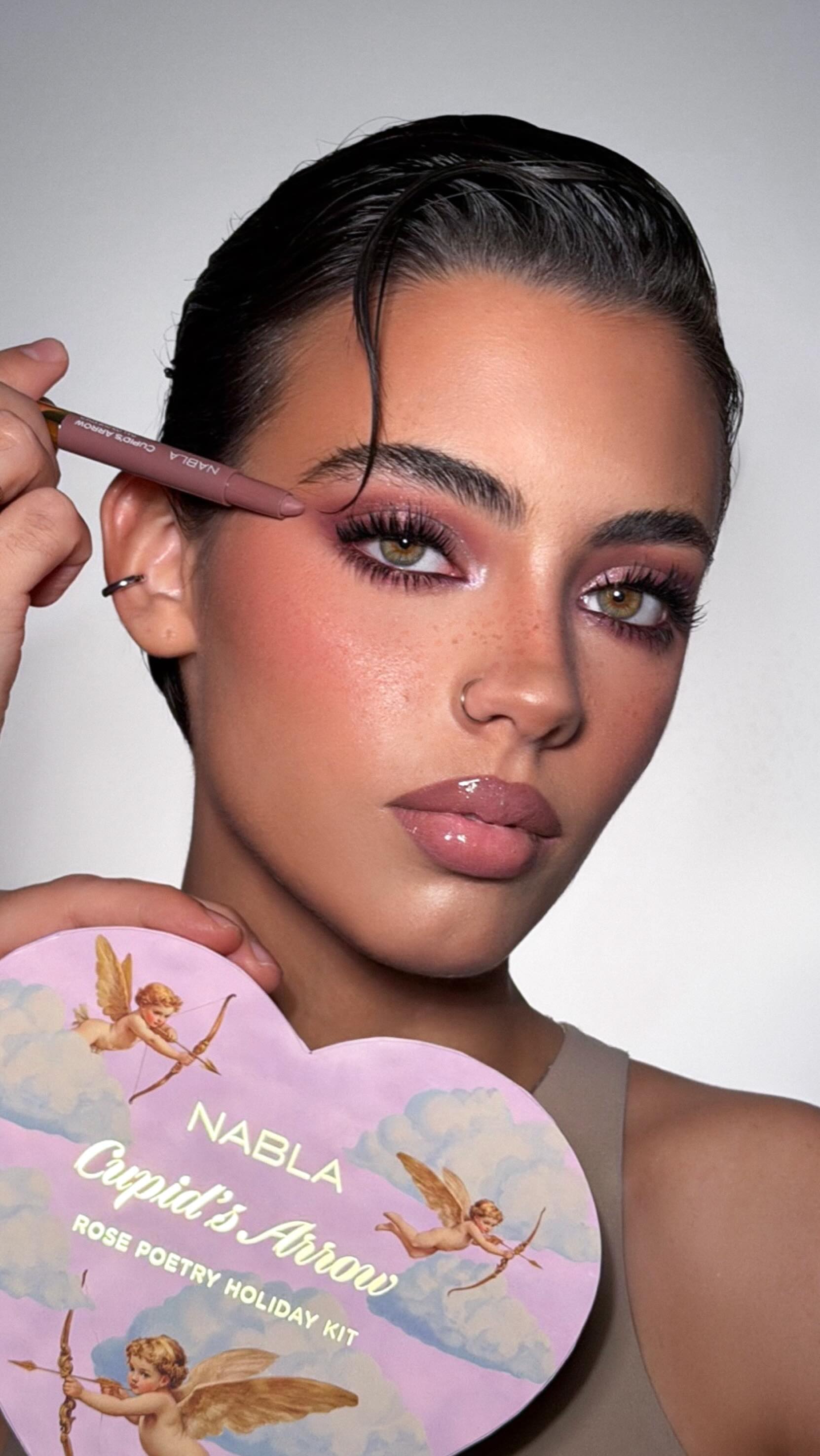 Instagram post by @mrdanielmakeup for NABLA Cosmetics. Caption reads: Rose Poetry Holiday Look using....