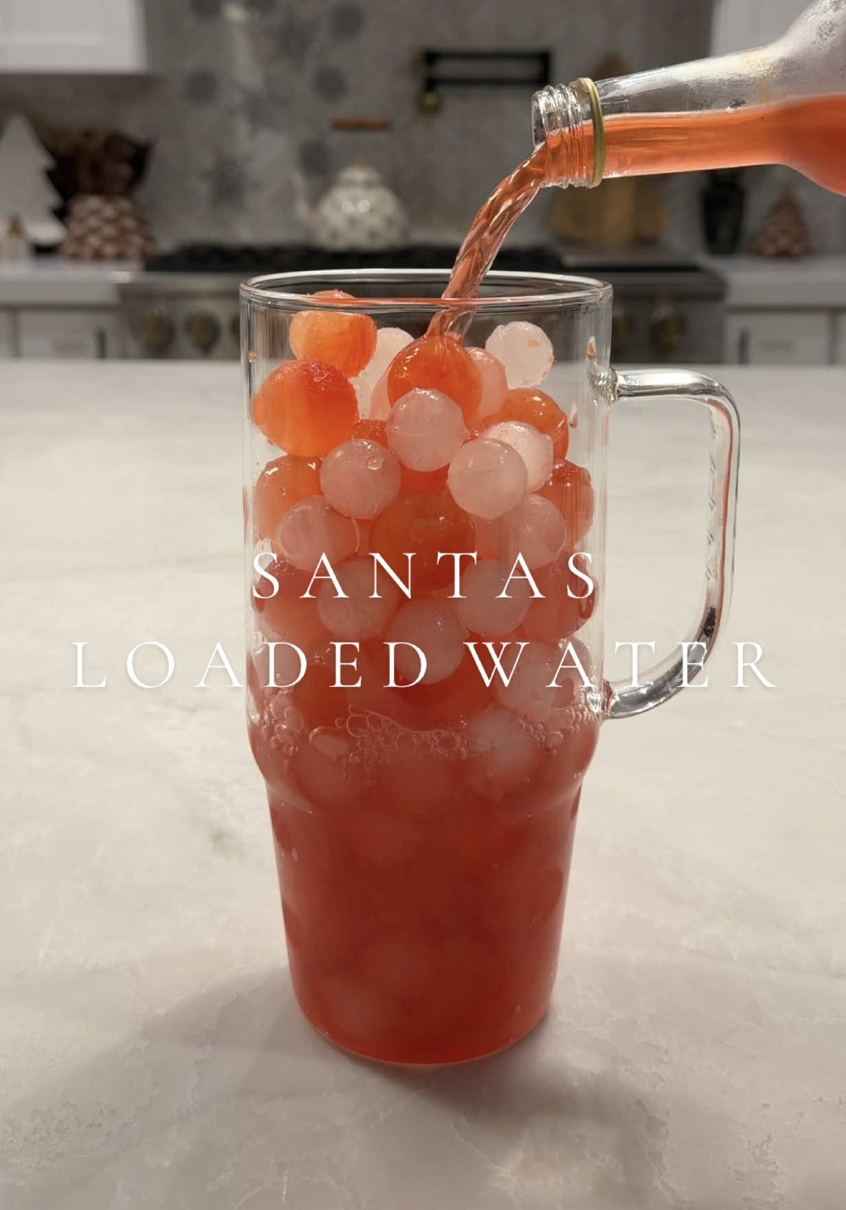 TikTok post by @mikaylamcn for World Market. Caption reads: [...] ❤️🫧🎅🏼🎄 Using Santa’s Potion from @World....