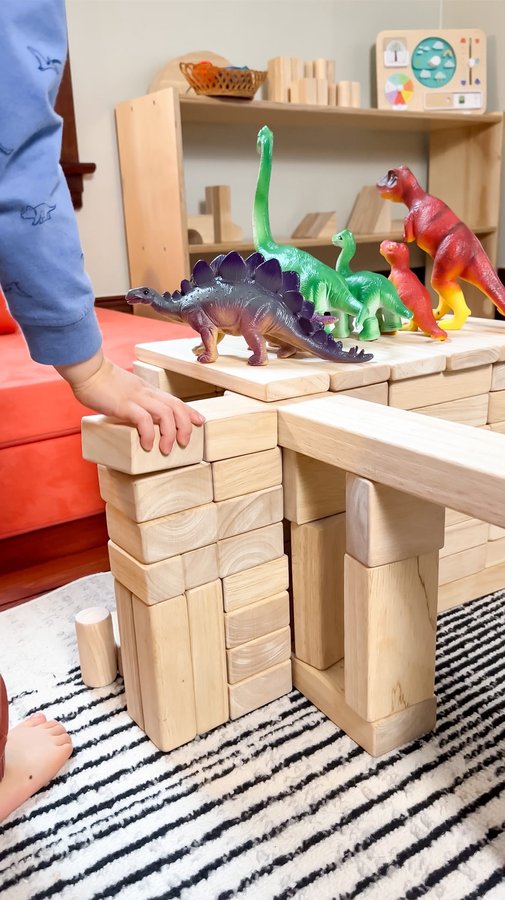 Instagram post by @a.calm.mom for Guidecraft. Caption reads: [...] the praises of our unit blocks from....