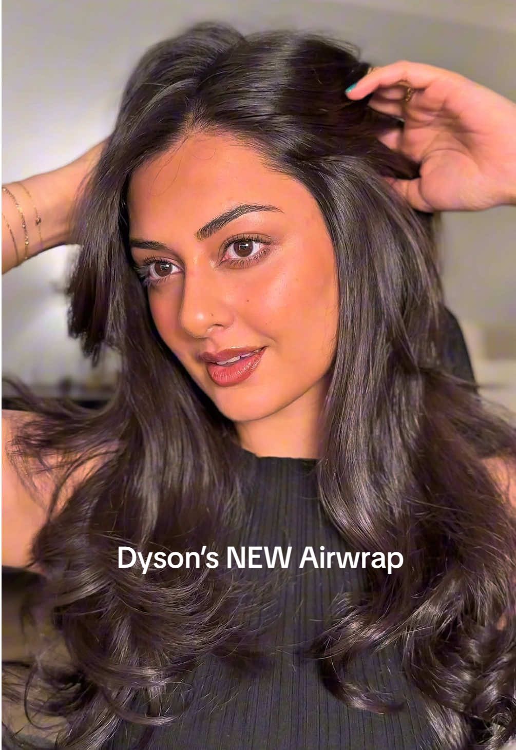 TikTok post by @lookwhoshira for Dyson. Caption reads: The new @Dyson USA Airwrap Co-anda2x™ is here — a....