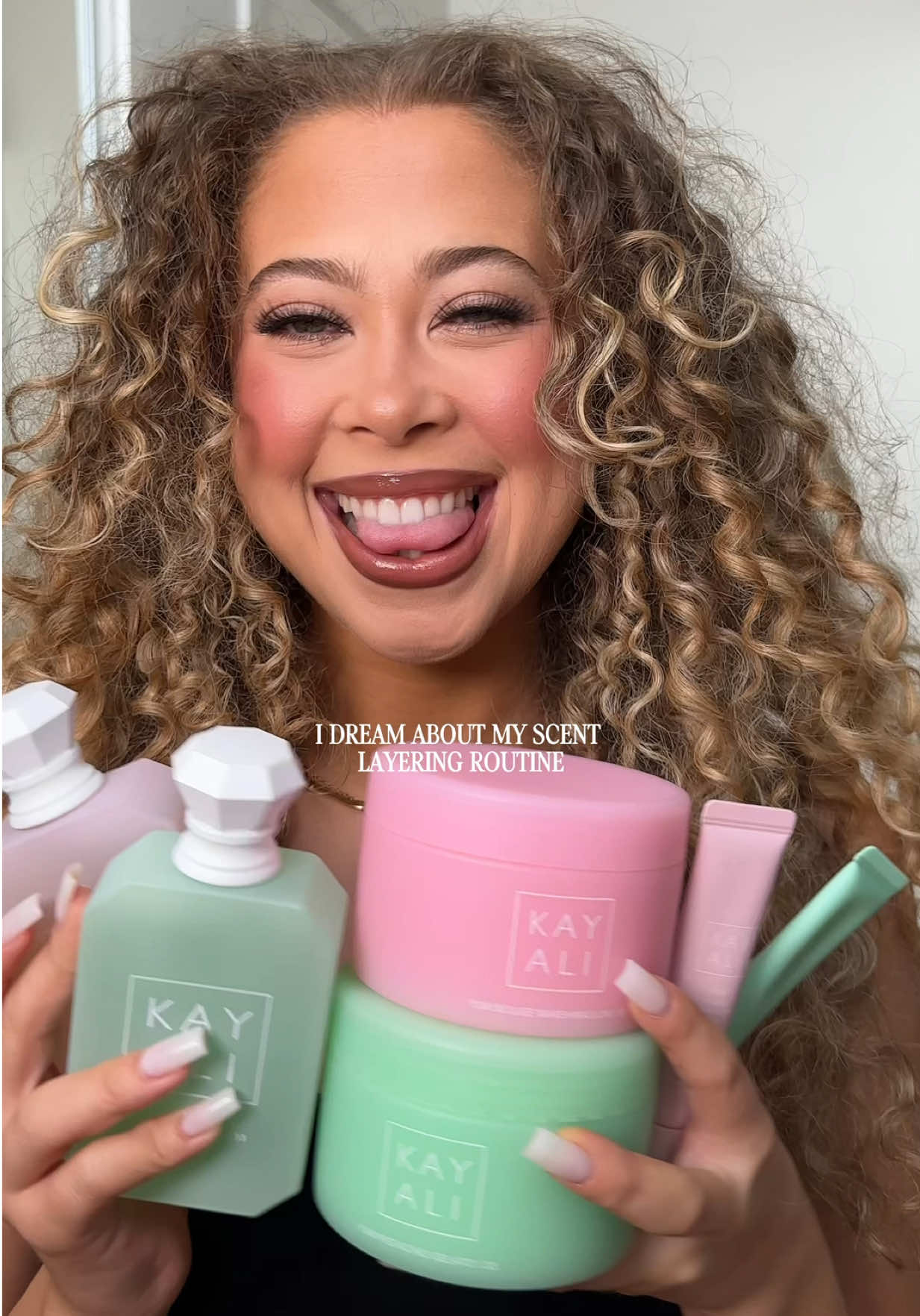 TikTok post by @maliaelaine for Kayali. Caption reads: [...] dreamy scent layering routine from the....