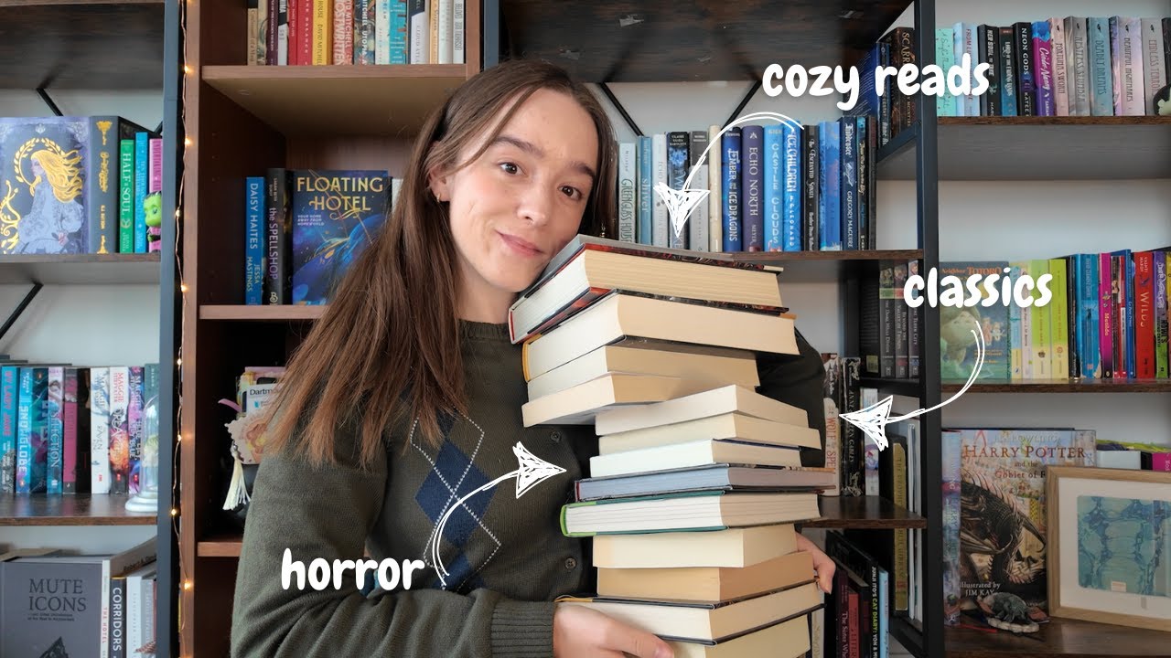 YouTube post by @emmiereads for BookoftheMonth. Caption reads: tier ranking my October TBR🍂☕️🕯️⚰️.