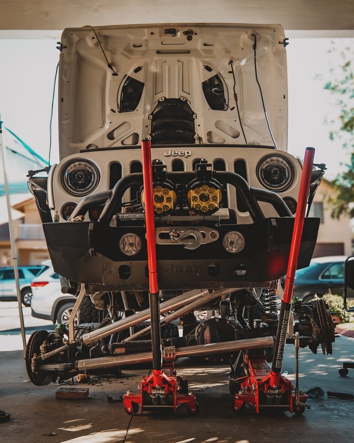 Instagram post by @skyjacker for DV8 Offroad. Caption reads: @skyjacker coilover & @dv8offroad ball joints and....